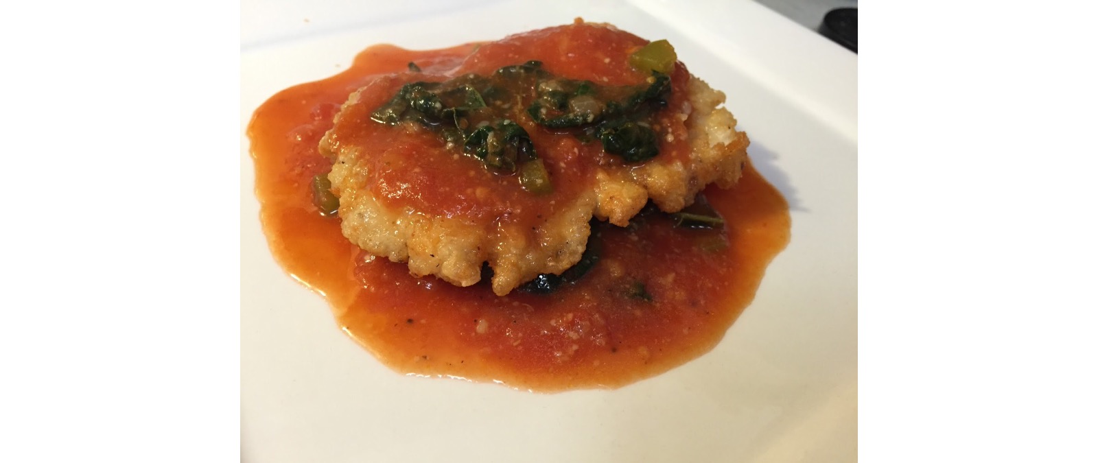 crispy chicken in tomato kale sauce